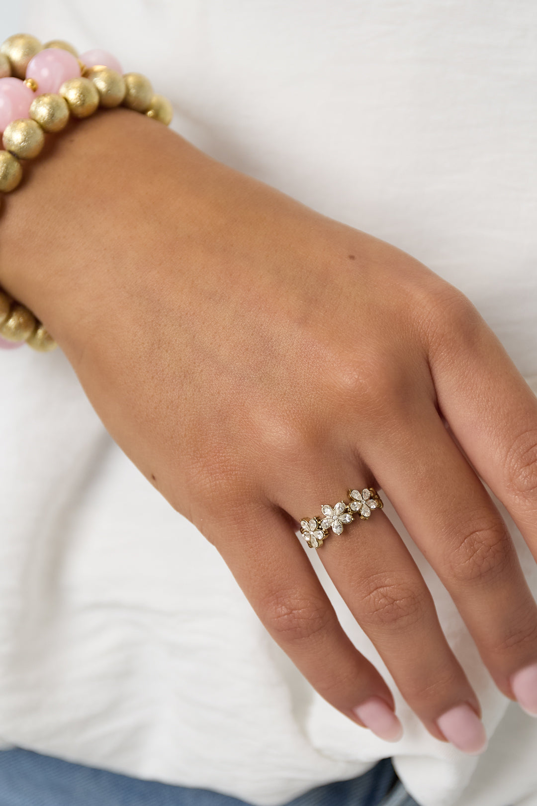 Anello regolabile con fiori e strass in acciaio inox – oro o argento